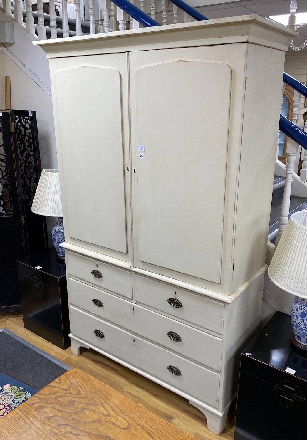 A late Victorian painted pine press cupboard, width 126cm, depth 50cm, height 211cm